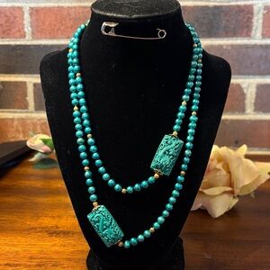 Teal dyed pearls with square dragon bead &
gold accents Necklace. Size 36 inches
